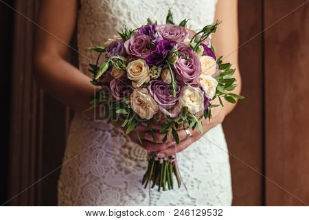 Young Beautiful Bride In White Dress Holding Wedding Bouquet, Bouquet Of Bride From Rose Cream Spray