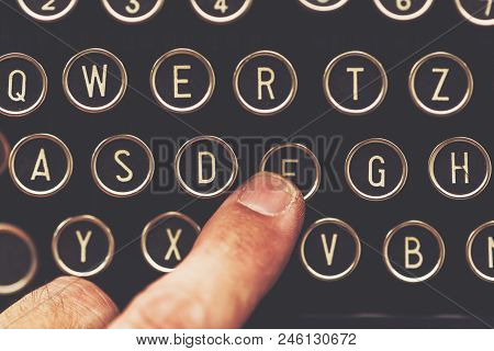 Finger On Vintage Typewriter Machine Pushing The F Key