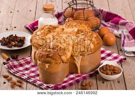 Easter Dove Bread Colomba Pasquale On Wooden Table.