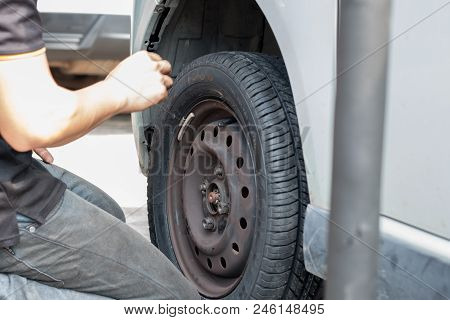 Selangor, Malaysia - June 28, 2018: A Mechanic Is Changing The Car Wheel At Tyre Shop In Kajang, Sel