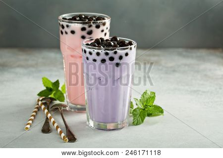 Taro And Strawberry Milk Bubble Tea With Ice In Tall Glasses