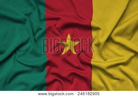 Cameroon Flag  Is Depicted On A Sports Cloth Fabric With Many Folds. Sport Team Waving Banner