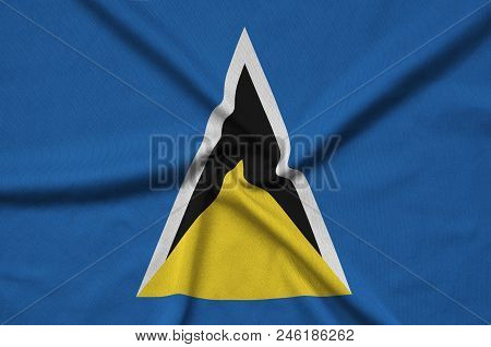 Saint Lucia Flag  Is Depicted On A Sports Cloth Fabric With Many Folds. Sport Team Waving Banner