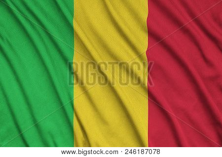Mali Flag  Is Depicted On A Sports Cloth Fabric With Many Folds. Sport Team Waving Banner