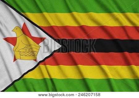 Zimbabwe Flag  Is Depicted On A Sports Cloth Fabric With Many Folds. Sport Team Waving Banner