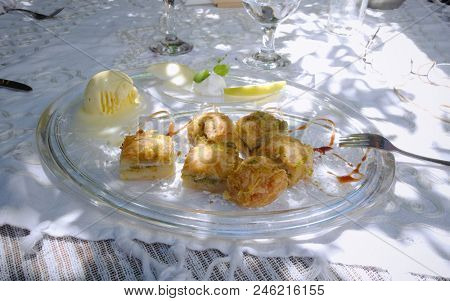 a baklava dessert with pistachio ice cream on the table of one of the best traditional cuisine restaurants in Sofia