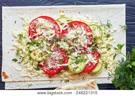 Flatbread Wraps Stuffed With Tomato And Zucchini Slices, Greens And Grated Mozzarella Cheese - Delic