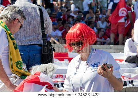 Volgograd - June 18: Girl Fan Of England Team With Red Hair Dressed In The National Team Uniform On 