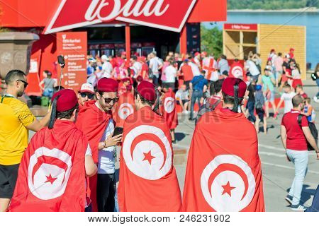 Football Fans Of The National Team Of Tunisia With National Flags And Attributes