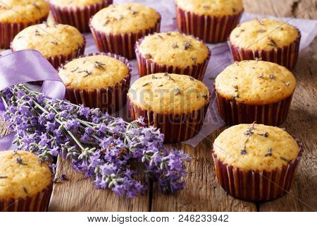 Beautiful Background Of French Muffins With Lavender Flowers Close-up. Horizontal