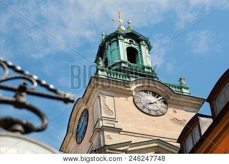 Clock Tower On Historical Church Storkyrkan Of Gamla Stan, Old Town In Sockholm, Sweden