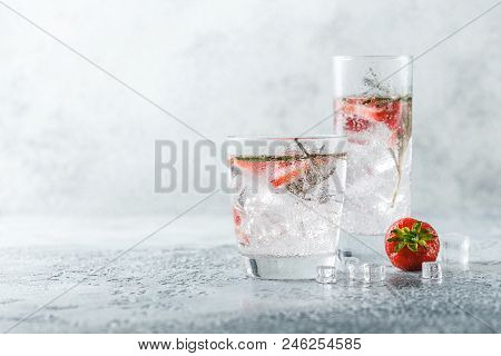 Alcoholic Or Non-alcoholic Cocktail With Strawberries And Rosemary And Ice In Glass Glasses. Free Sp
