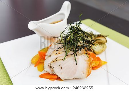Picture Of A Plate With Pigling Steaks And Vegetables