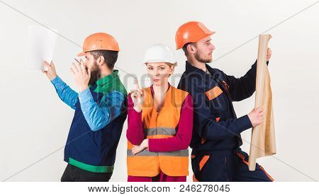 Men And Woman In Helmets Carefree With Hammer And Project, White Background. Inspector Disappointed 