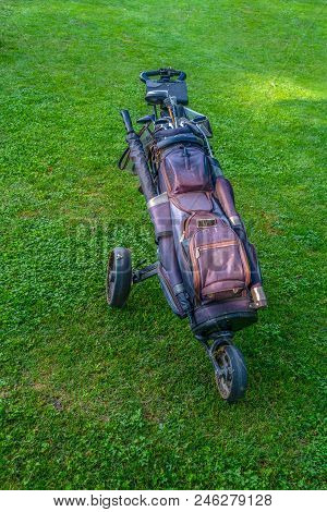 Golf Bag With Clubs On Roller Stand On Golf Course, Authentic, Not Staged, After Plaz With Muddy Whe