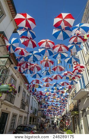 Colorful Umbrellas Above The Street In  Agueda