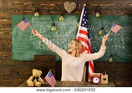 Patriotism, National Pride And Independence Day Concept - Happy Girl In With American Flag