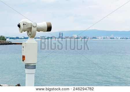 Old Coin Operated Touristic View Telescope With Blurred City And Sea Landscape Background, Shallow D