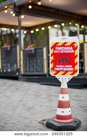 Closeup Of No Parking Sign. Vertical Shot. Red And White No Parking Sign, In Russian And Romanian