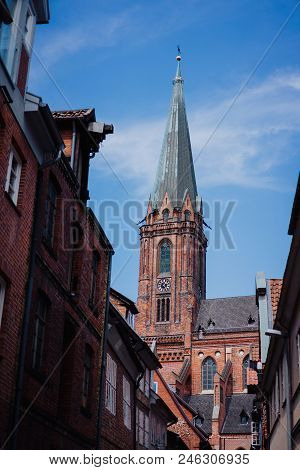 Traditional Facades And Roofs, Gothic Cathedral Church In The Historic Centre Of Luneburg, Germany.