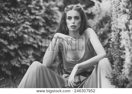 Fashion Portrait Of A Sensual Sexy Girl. Pretty Sensual Young Woman With Bright Makeup And Long Curl