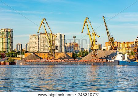 Barges And Cranes In The River Port