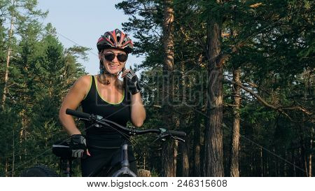Fat Bike Also Called Fatbike Or Fat-tire Bike In Summer Riding In The Forest. Beautiful Girl And Her