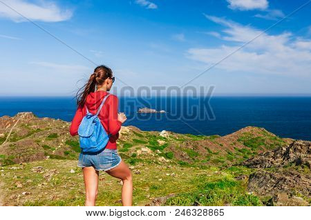 Tourist Woman With Backpack On Cap De Creus, Natural Park. Eastern Point Of Spain, Girona Province, 