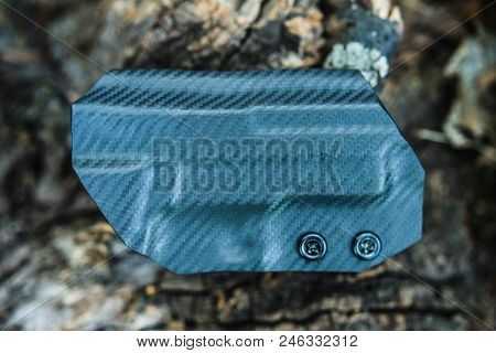 Objective Shooting Holster On The Bark Of A Tree In The Forest