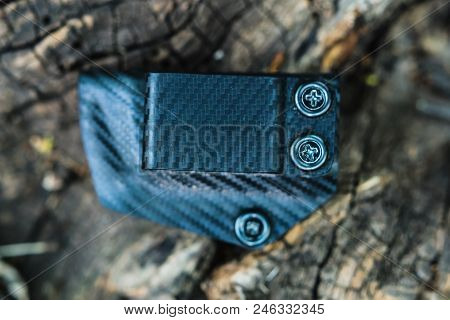 Objective Shooting Holster On The Bark Of A Tree In The Forest