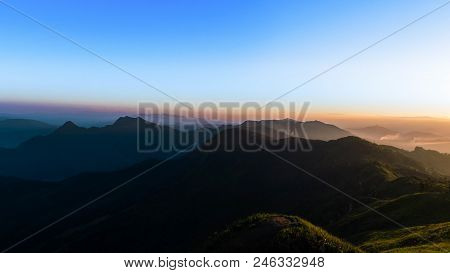 Beauty Sunshine And Twilight Over The Peaks Of Phu Chi Fa, Chiang Rai, Thailand.