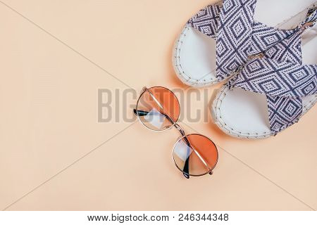 Summer Fashion Flatlay With Gradient Round Sunglasses And Espadrille Sandals On The Beige Background