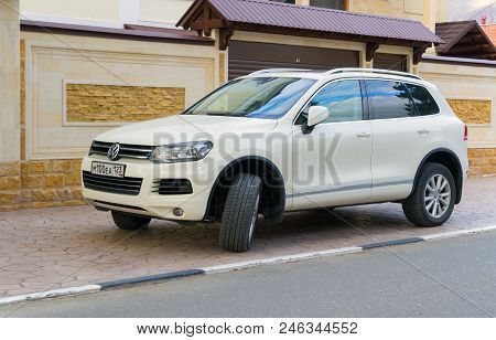 Novorossijsk, Russia - November 26, 2017: New Volkswagen Tuareg Parked Near House In Street Near Hou