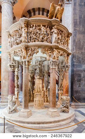 PISA, ITALY - MAY 31, 2018: Italian gothic Pulpit by Giovanni Pisano in Pisa Cathedral at Piazza dei Miracoli (Piazza del Duomo)