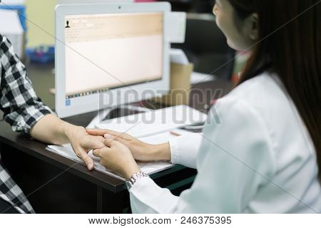 Friendly Woman Doctor Hands Holding Patient Hand Sitting At The Desk For Encouragement, Empathy, Che