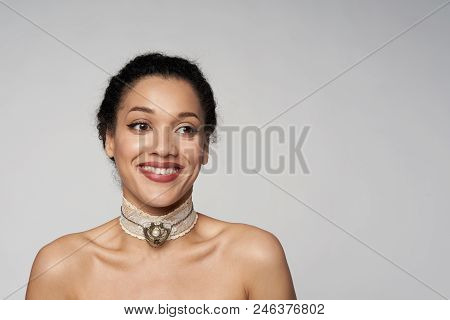 Happy Laughing Closeup Portrait Of Beautiful Mixed Race Woman Wearing Chocker Looking Away, Isolated