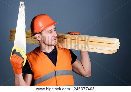 Woodcraft Concept. Carpenter, Woodworker, Labourer, Builder On Thoughtful Face Carries Wooden Beams 
