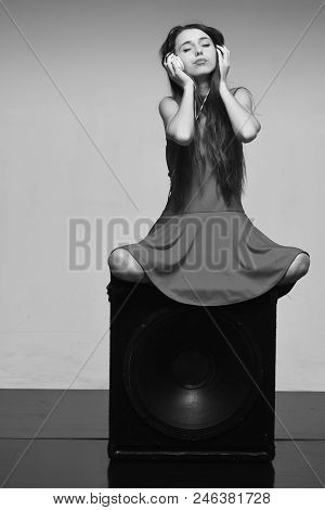 Music And Leisure Concept. Dj Sound Concept. Girl With Relaxed Face Sits On Black Loudspeaker, Copy 