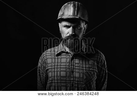 Construction And Hard Work Concept. Builder Or Repairer With Thick Beard. Man With Serious Face Expr