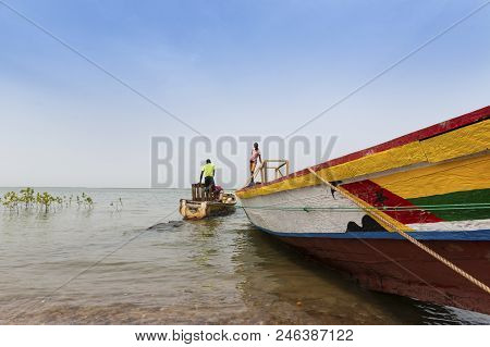 Cacheu, Republic Of Guinea-bissau - February 1, 2018: Fishermen Preparing Their Canoes In The Port O