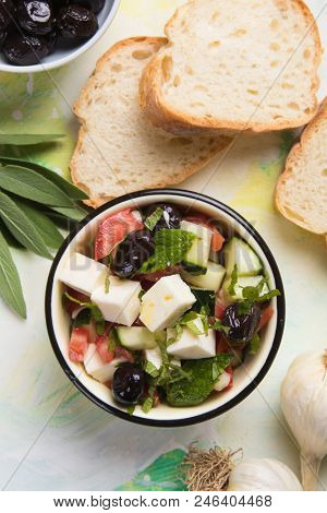 Greek salad with feta cheese cubes and fresk vegetables