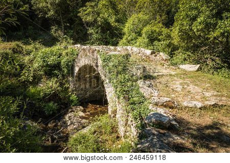 Genoese Stone Arch Bridge In Balagne Region Of Corsica