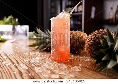 A Red Pina Colada Coctail Is Made Of Ripe Pineapples And Decorated With Cubed Ice.