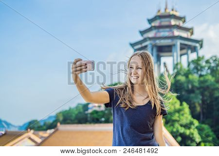 Young Woman Tourist In Buddhist Temple Kek Lok Si In Penang, Malaysia, Georgetown.