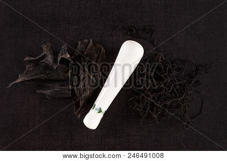 Traditional Chinese Medicine Seaweed And Dan Shen On Black Background. Tcm Top View.