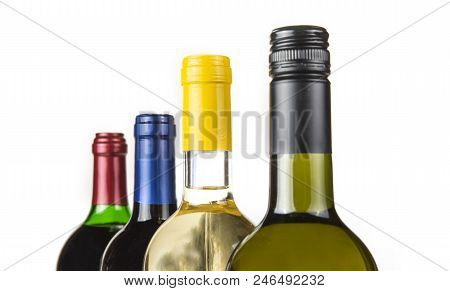 Four Closed Botteles Of Wine In The  Raw On The White