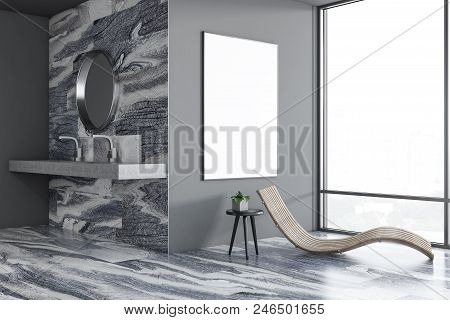 Luxury Gray Bathroom Interior With A Sink And A Round Mirror, A Loft Window And A Deck Chair. A Marb