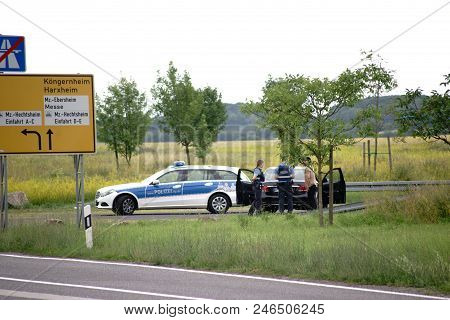 Mainz, Germany - June 17: A Police Ambulance With Two Police Officers Carry Out A Control Of A Car D