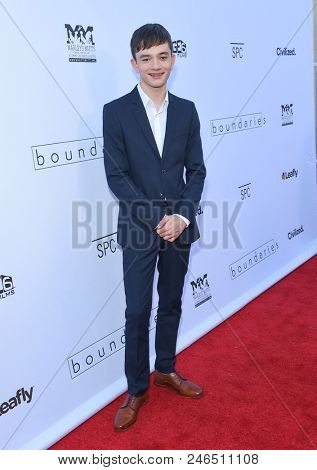 LOS ANGELES - JUN 19:  Lewis MacDougall arrives for the 'Boundaries' Los Angeles Premiere on June 19, 2018 in Hollywood, CA