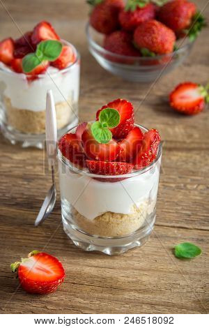 Strawberry Trifle Mini Dessert In Glasses With Fresh Strawberries And Cream Cheese  On Wooden Backgr